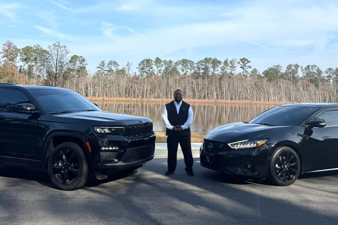 Derrick with His Two Vehicles